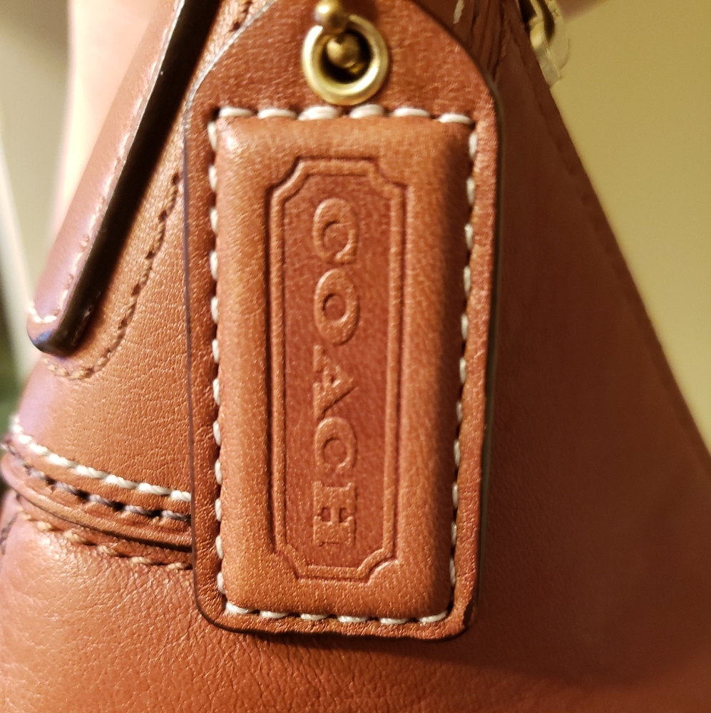 Tan leather Coach purse.
